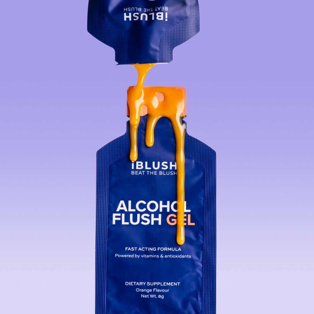 Close-up of iBlush Alcohol Flush Gel packaging with orange gel drops, highlighting product texture and sleek design.